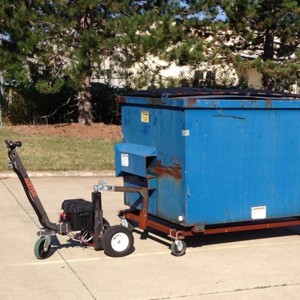 side view of dumpster tug in use