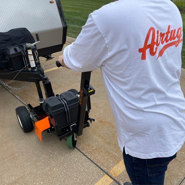 back view of man using airtug light duty trailer tug