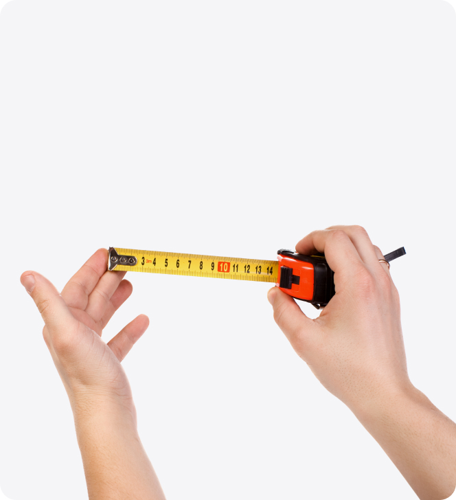 hands holding out a tape measure